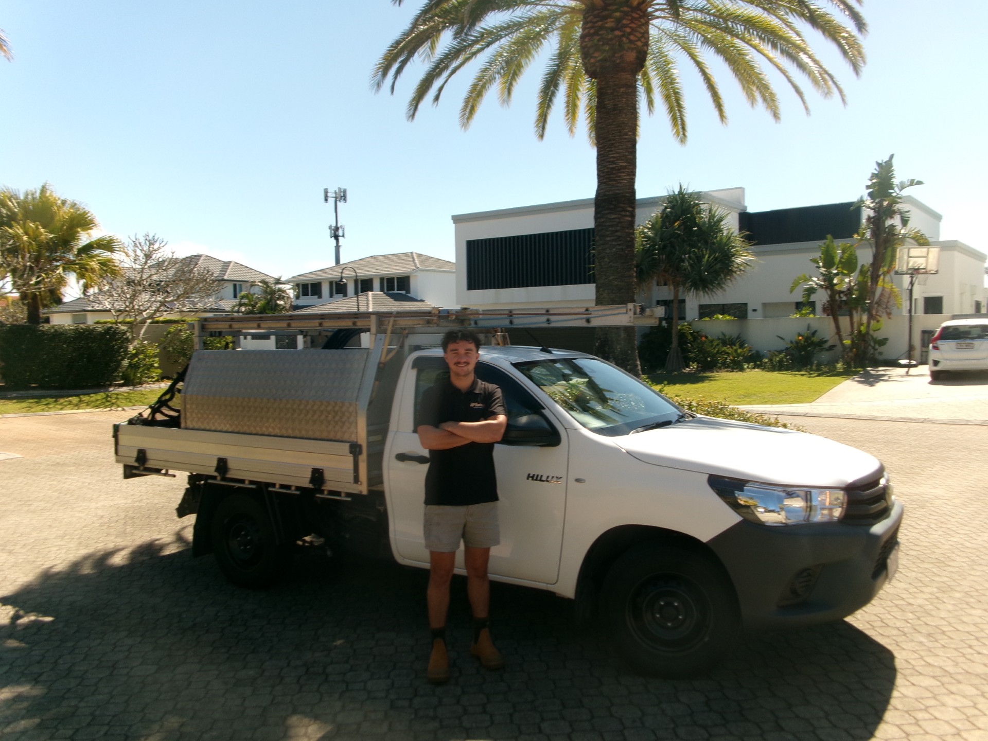 Christian, licensed plumber, beside the iPlumb Gold Coast service vehicle
